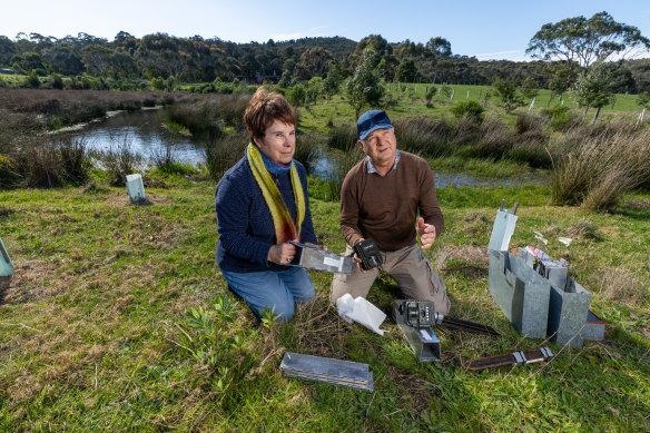 Ecologists Barbara Wilson and Mark Garkaklis with the traps they set to record the presence of native mammals. 