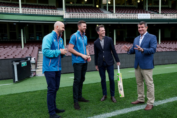 Premier Chris Minns with former premier and Cricket Australia chairman Mike Baird and Australian cricketers Nathan Lyon and Josh Hazlewood at the SCG on Sunday.