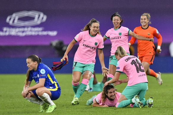 Barcelona players celebrate their first Women’s Champions League crown.