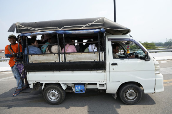 Myanmar residents cross the 1st Thai-Myanmar Friendship Bridge into Thailand on Friday.