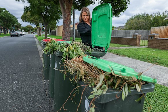 Jacky Stibilj with bins in her neighbourhood which that have not been collected. 