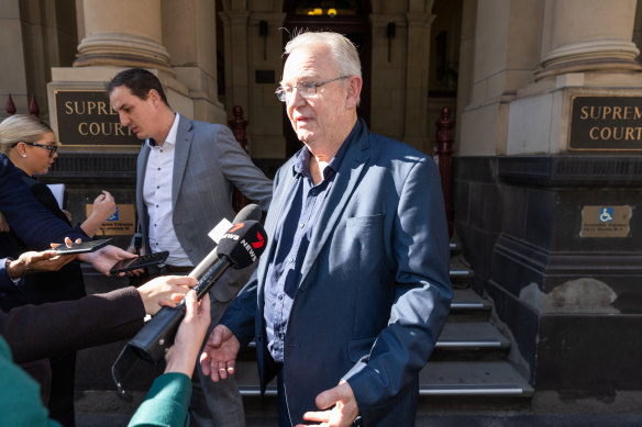 I Cook Foods owner Ian Cook (centre) outside the Supreme Court.