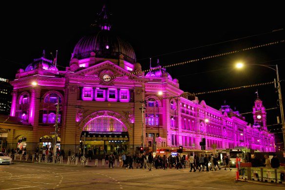 Flinders Street Station in Melbourne is lit in regal purple in honour of the Queen on September 9.