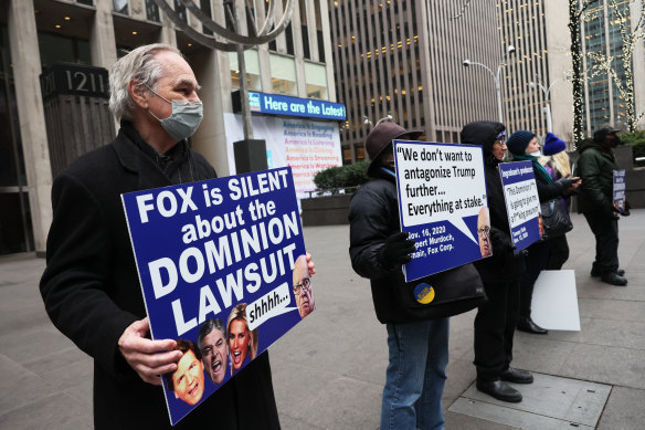 Protesters participate in their weekly Truth Tuesday demonstration at News Corp headquarters.