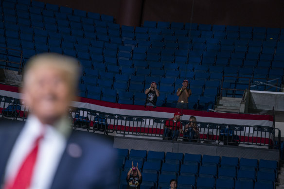 Trump supporters cheer as the US President speaks during a campaign rally in Tulsa.