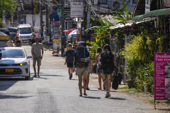 Backpacker tourists roam around in Vang Vieng, Laos.