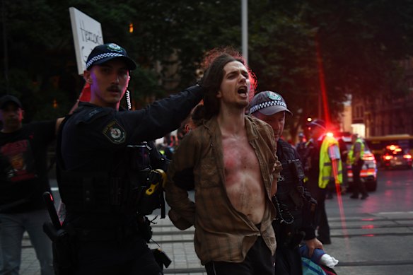 Protesters clashed with police near Sydney’s Town Hall on Monday night during Israeli President Isaac Herzog’s visit to Sydney.