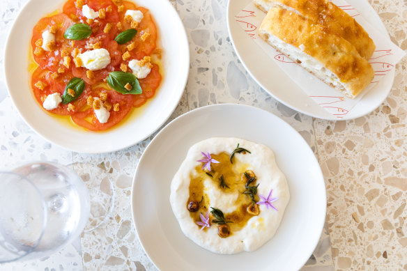 Oxheart tomato and goat’s curd salad with stracciatella and focaccia.