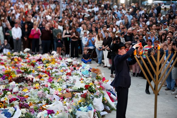 Mourners at a vigil at Bondi Pavilion the day after the attack.