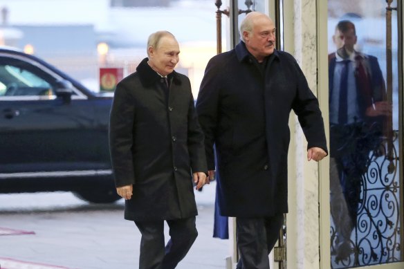 Russian President Vladimir Putin and Belarusian President Alexander Lukashenko arrive for their talks in Minsk.