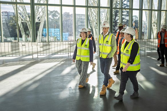 Premier Chris Minns, with Parramatta MP Donna Davis (left) and Powerhouse museum chief executive Lisa Havilah (right), toured the new site on Friday morning.