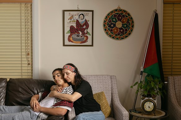 Kefah Maradweh and her son, Nedal. She said the 16-year-old was grabbed by police and thrown to the ground.