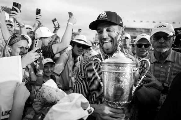 Bryson DeChambeau celebrates with fans after winning the US Open.