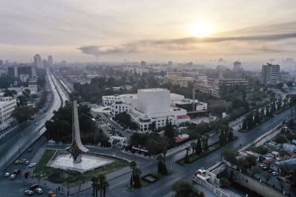 A column of black smoke allegedly caused by an Israeli airstrike, as seen from Umayyad Square in Damascus.