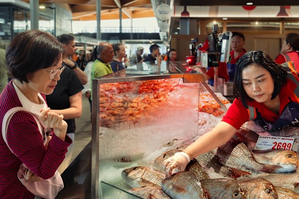 People visit the new Sydney Fish Market on Good Friday morning. 
