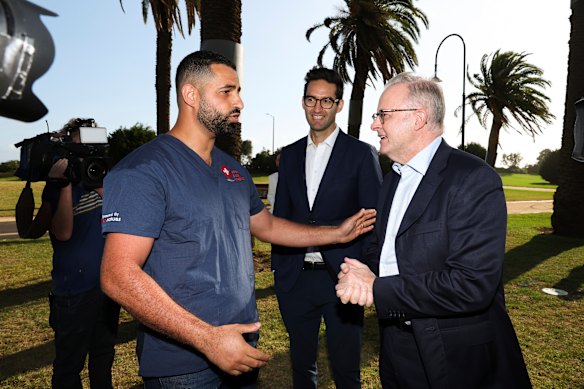 Prime Minister Anthony Albanese and Macnamara MP Josh Burns (centre) with Dr Daniel Nour on Monday.