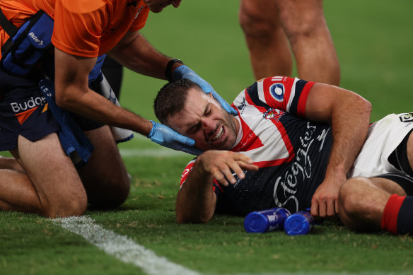 James Tedesco is treated for concussion after Bailey Simonsson’s high shot.