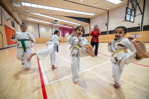 Left to right: Teghveer Singh, Zeerak Khan, Sidak Kaur, Sensei Lillian Zammit and Arya Khan at Kobudo Kai karate dojo, which trains at Nearnung Primary School at Tarneit.