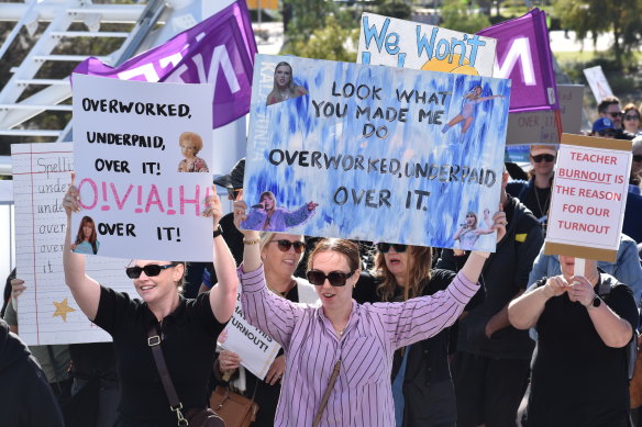 Signs at the rally often conveyed the message that teachers were “underworked, overpaid and over it”.