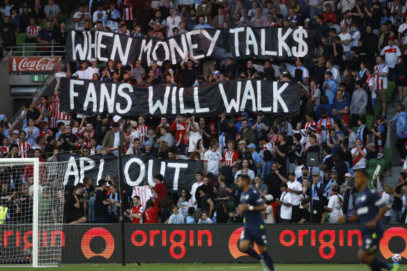 Fans show their disappointment with the APL before the December 17 Melbourne derby, which descended into chaos.