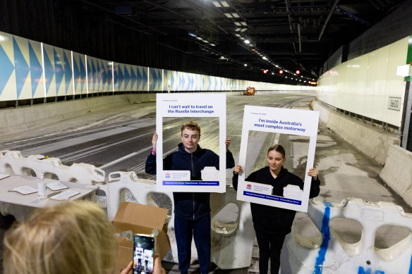 Elizabeth McGarrigle photographs her children Cleo and Connal inside the Rozelle Interchange on Sunday.