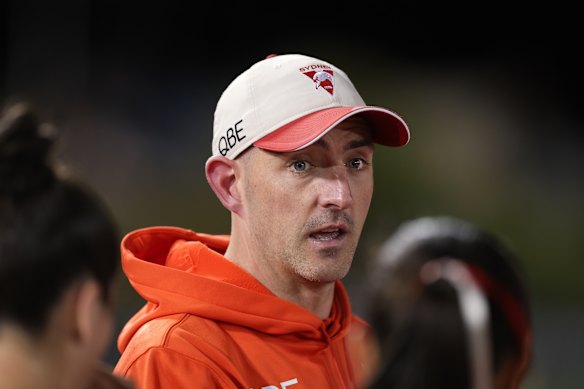 Swans coach Colin O’Riordan speaks to his players during the round three AFLW match between Sydney and St Kilda in Coffs Harbour. 