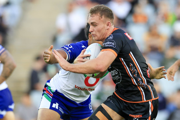 Jacob Liddle runs the ball for the Tigers.