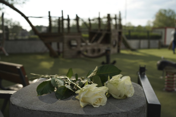 Roses lay at the playground after a knife attack in Annecy, French. 