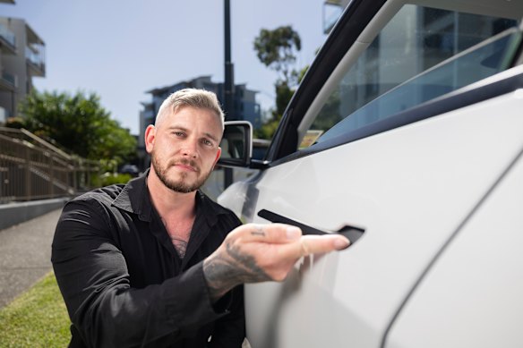 Callan Root, who bought his Tesla in December, likes the sleek look of the hidden electronic door handles, but concedes they could pose a safety hazard. 