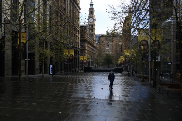 A pedestrian walks through an almost empty Martin Place this week.
