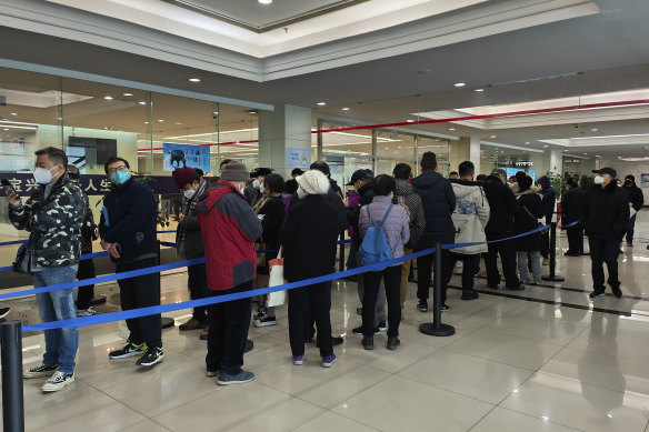 Family members of the deceased line up for the cremation procedures at a funeral home in Shanghai, China on January 4, 2023. 