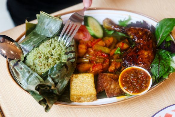 Nasi gurih pandan (pandan coconut rice) and ayam bakar (grilled chicken).