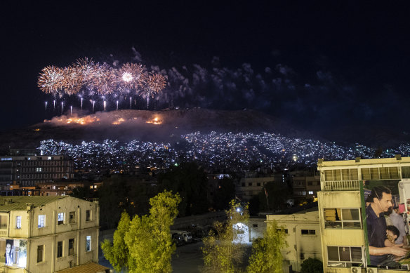Fireworks explode over Qasioun Mountain as Syrian President Bashar al-Assad supporters celebrate his re-election.