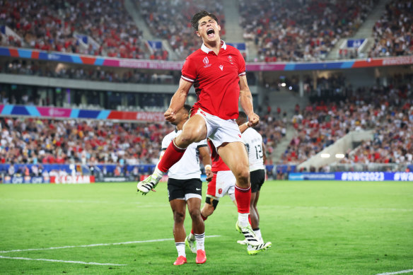 Louis Rees-Zammit celebrates Wales’ victory.