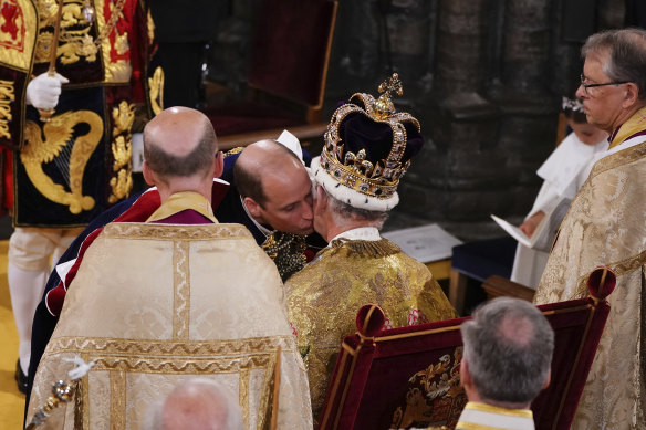  Prince William kisses his father, King Charles III.