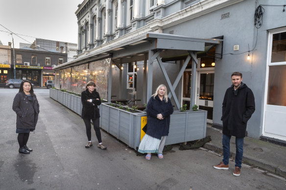 Resident Susan Louey (left) with neighbours Caroline, Margaret Leever and Chris in front of The Wolf Windsor’s outdoor dining area.