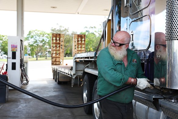 Truck driver Chris Gibbs fills the tank.  Australia’s dependency on diesel has become a major problem in the Iran fuel crisis.