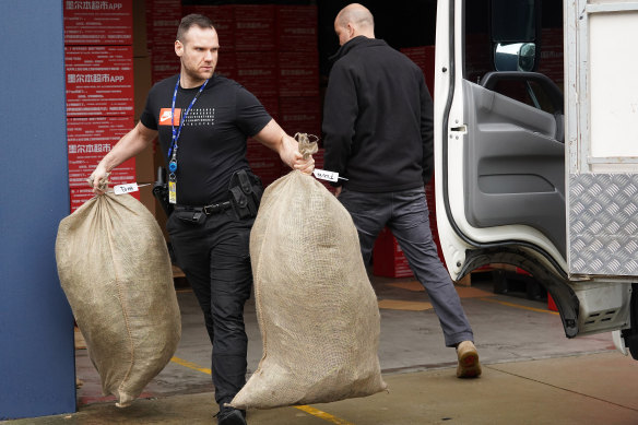 Police remove bags of marijuana after a raid in Carrum on Wednesday.