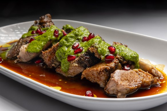 Lamb shoulder with pomegranate and zhoug.