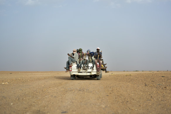 Migrants head towards Libya from Agadez, Niger in 2018. The desert is a common route for migrants seeking passage to Europe.