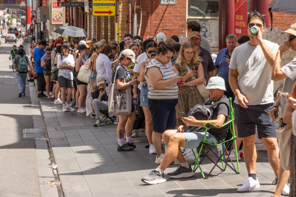 Taylor Swift fans suffered through the heat to get newly released tickets at Ticketek in Melbourne.