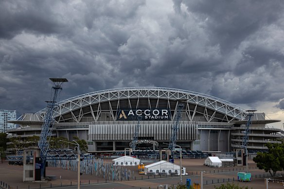 Storm clouds roll over Stadium Australia in Olympic park this afternoon.