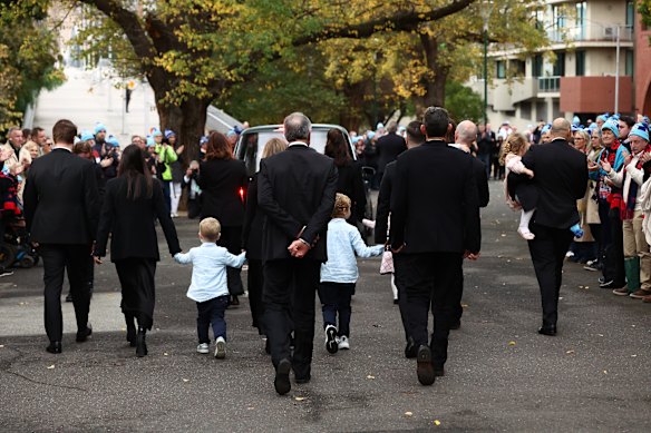 The Daniher family follow Neale’s hearse away from the MCG.