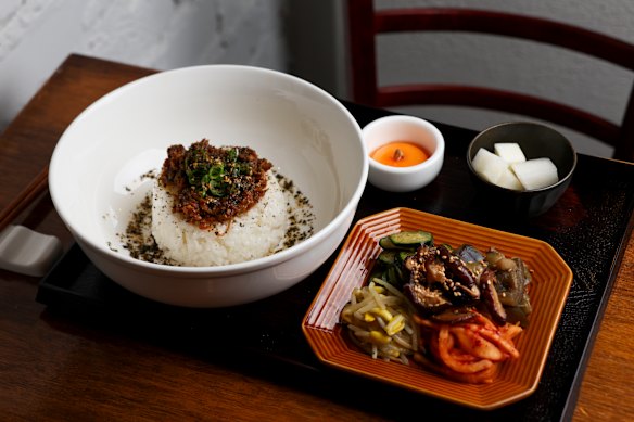 Miso mushroom with fermented umami mushroom sauce, rice, seasonal vegetables and egg yolk.