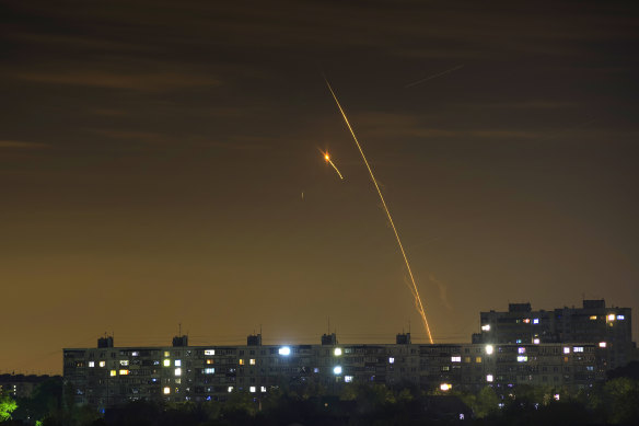 Russian rockets launch against Ukraine from Russia’s Belgorod region are seen at dawn in Kharkiv, Ukraine, early Sunday, May 14.