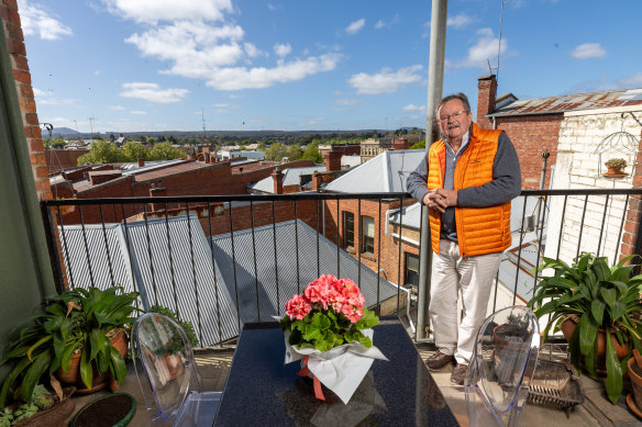 James Coghlan on the balcony of his Ballarat apartment, which looks over the city. 