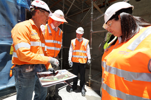 Cross River Rail boss Graeme Newton briefs state and federal MPs, including then acting premier Steven Miles. The $6.3 billion mega project is one of many on the government’s growing books.