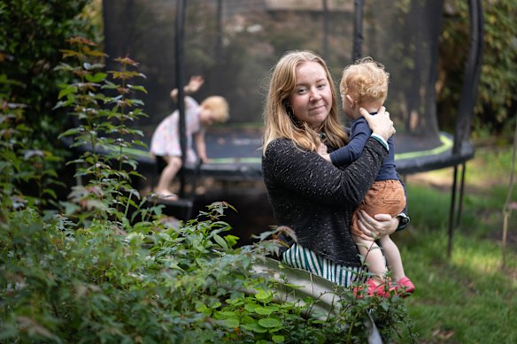 Kate with her two youngest children in her Medlow Bath home, which has high levels of PFAS in the soil.