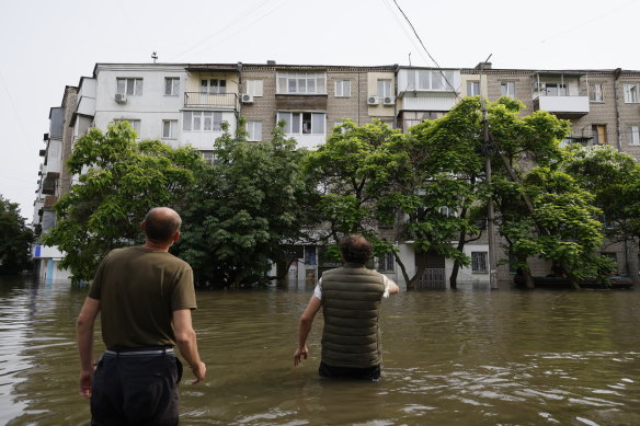 Volunteers offer evacuation for the local residents of a building in Kherson, Ukraine. 