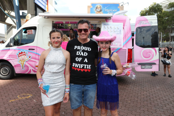 Father Gavin with his daughters, Penny and Zarlie.